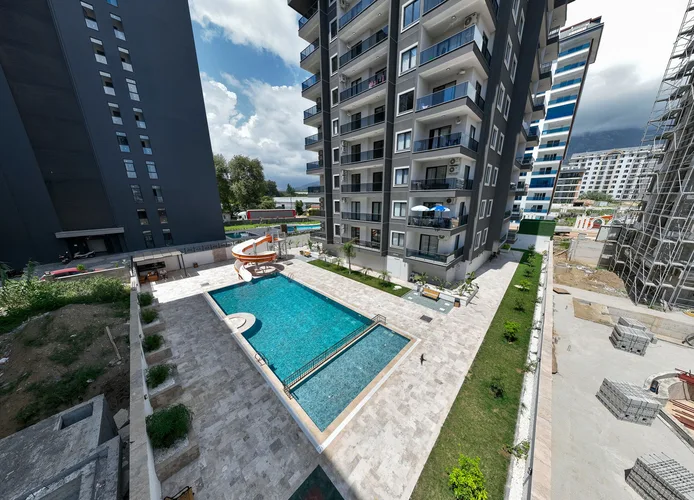 FULLY FURNISHED 1+1 APARTMENT FOR SALE IN A NEW BUILDING IN MAHMUTLAR