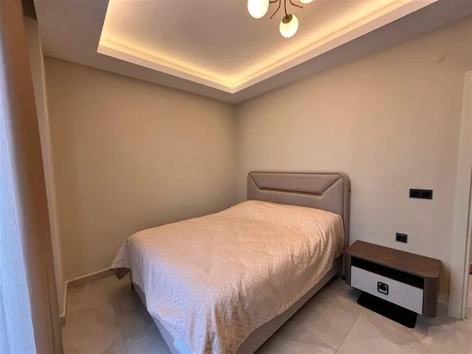 FULLY FURNISHED 1+1 APARTMENT FOR SALE IN A NEW BUILDING IN MAHMUTLAR