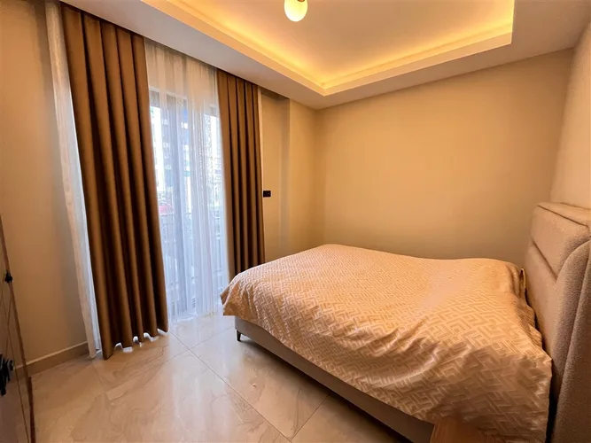 FULLY FURNISHED 1+1 APARTMENT FOR SALE IN A NEW BUILDING IN MAHMUTLAR