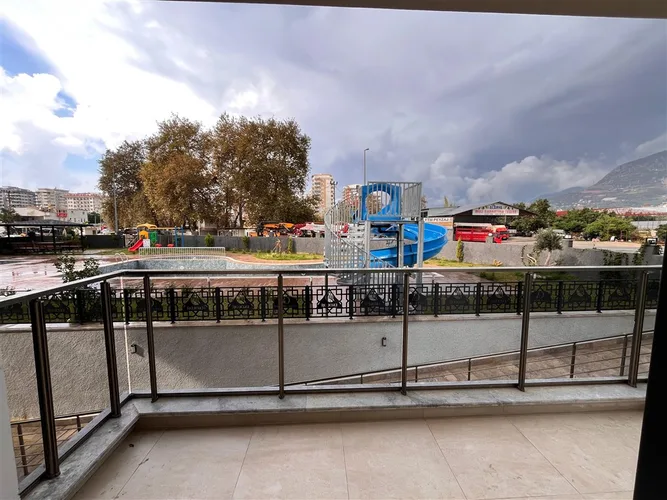 FULLY FURNISHED 1+1 APARTMENT FOR SALE IN A NEW BUILDING IN MAHMUTLAR