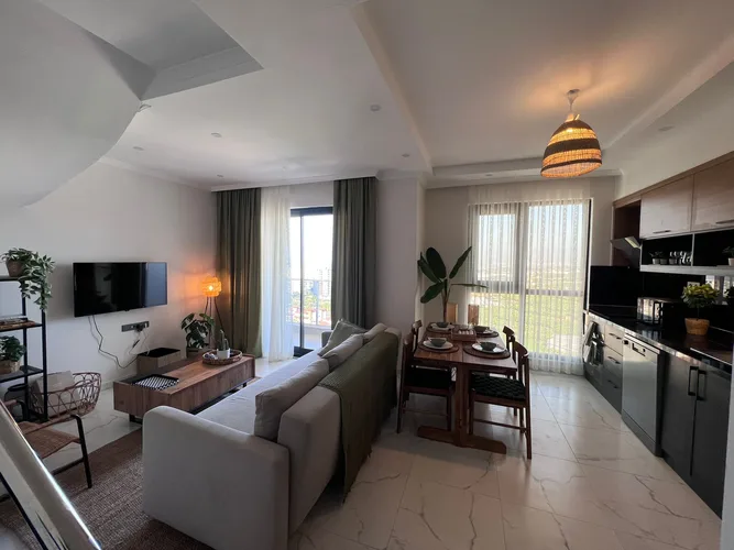 2+1 DUPLEX APARTMENT WITH MOUNTAIN AND SEA VIEWS IN MAHMUTLAR, FURNISH