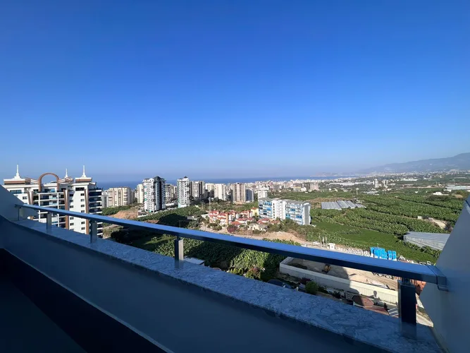 2+1 DUPLEX APARTMENT WITH MOUNTAIN AND SEA VIEWS IN MAHMUTLAR, FURNISH