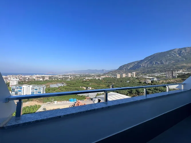 2+1 DUPLEX APARTMENT WITH MOUNTAIN AND SEA VIEWS IN MAHMUTLAR, FURNISH