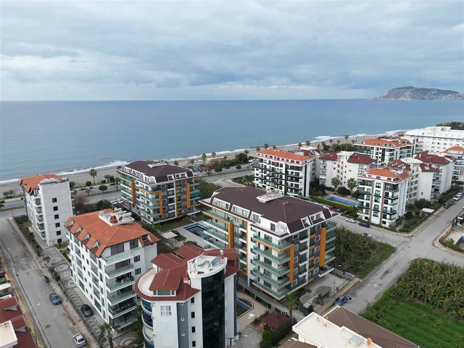 1+1 FURNISHED APARTMENT RIGHT ON THE BEACH IN ALANYA KESTEL.