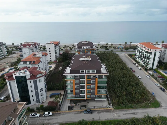 1+1 FURNISHED APARTMENT RIGHT ON THE BEACH IN ALANYA KESTEL.