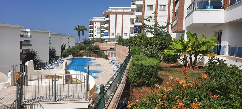 GRANADA RESİDENCE Furnished 1+1 apartment with a sea view in Kargicak 
