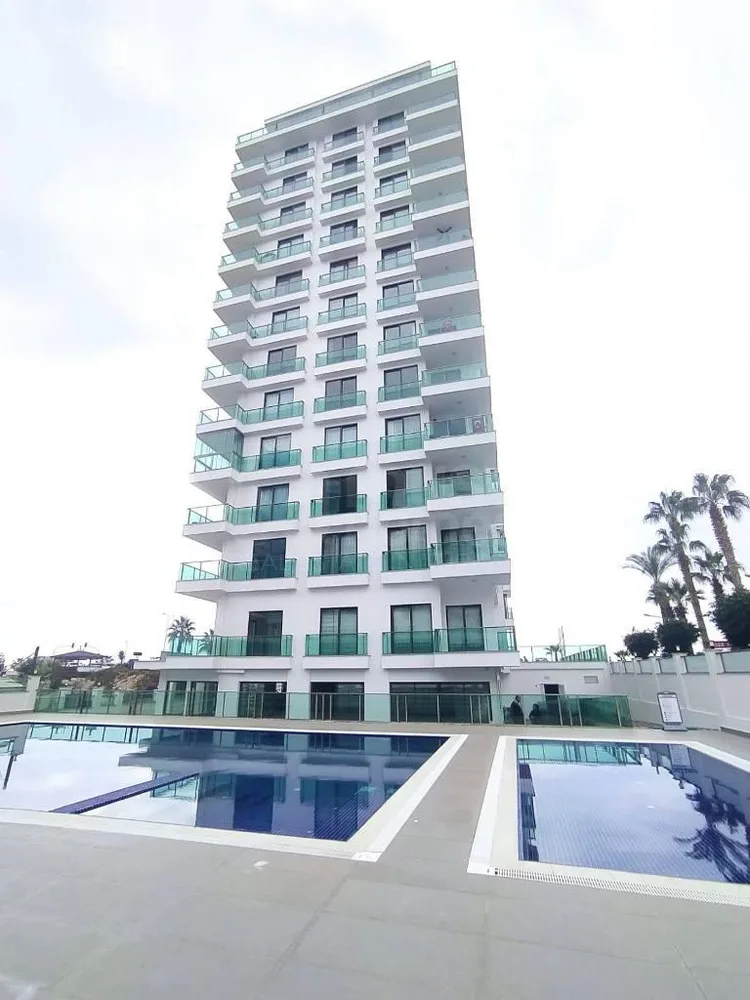 SUNSET AQUA Furnished 2+1 apartment in front of the sea in Mahmutlar 