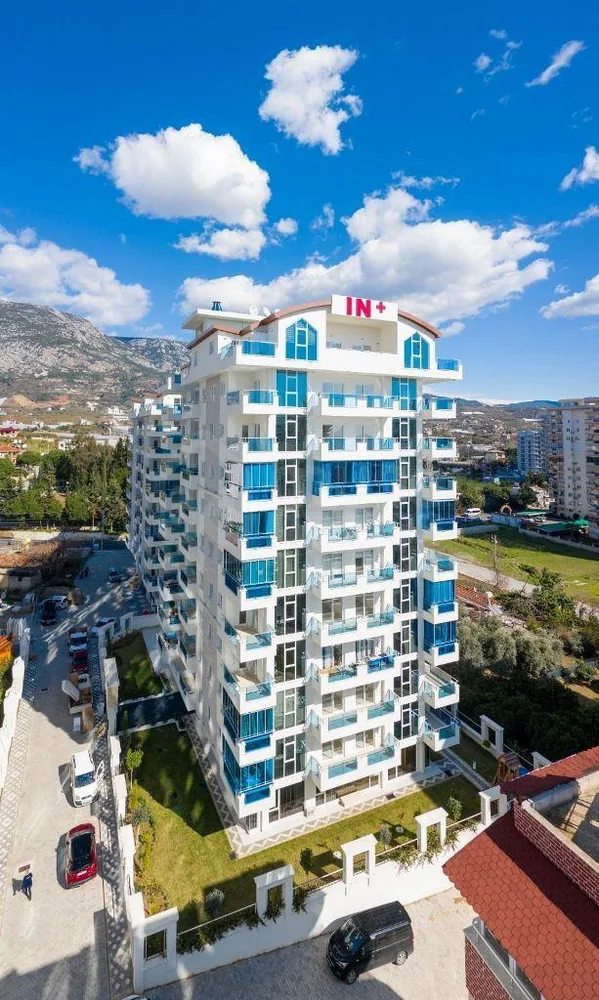 YEKTA IN + Furnished 2+1 duplex with a sea view in Mahmutlar 