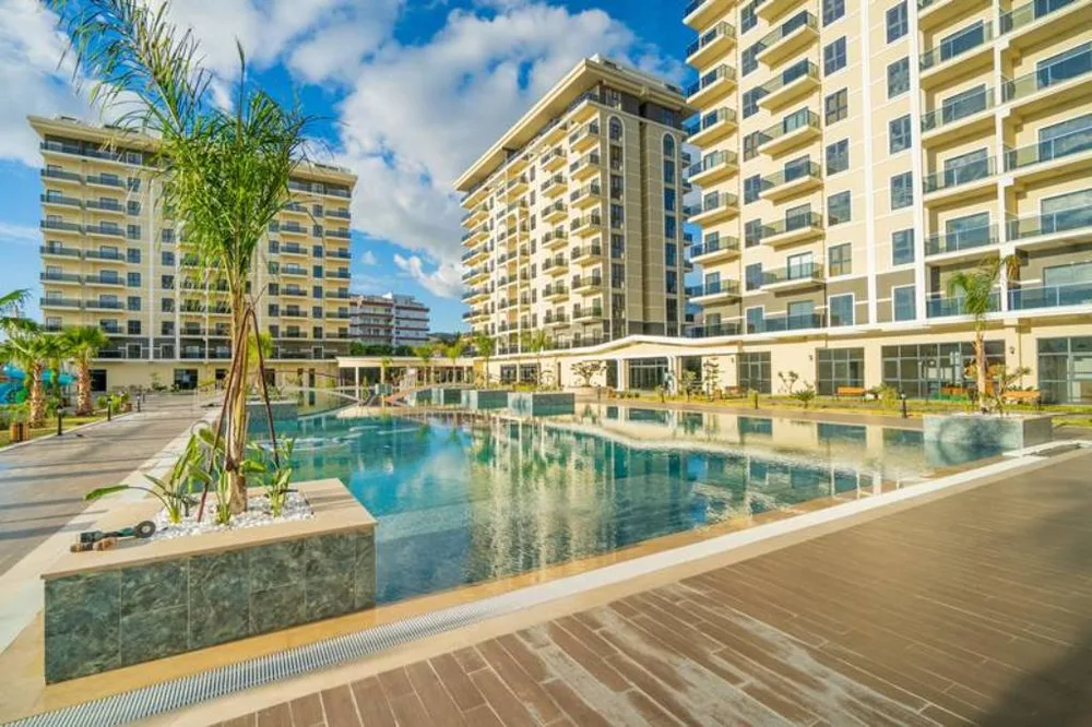 EXODUS RIVERSIDE 2+1 apartment with a sea view in Demirtas 
